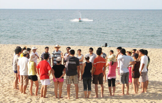 Da nang, Viet Nam - 20 June,2010: This is one team building event of one company at Da nang city of Viet nam. They join team activities with happy faces and very funny.